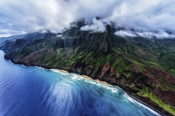 Na Pali Coast Kauai Hawaii Taken from an open door helicopter The clouds began to break as we were headed back inland Photo by Keith Manning 