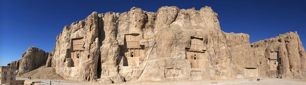 Naqsh-e Rustam is an ancient necropolis once belonging to Achaemenid kings located northwest of Persepolis in Iran The oldest relief dates to c  BC Though it is severely damaged it depicts a faint image of a man with unusual head-gear which is thought to 