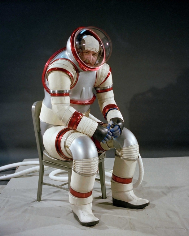 NASA designer Vic Vykukal demonstrates the AX- hard-shell spacesuit  The AX- enables movement by using ball bearings and wedges at the joints and can function at higher pressures than traditional soft-shell suits