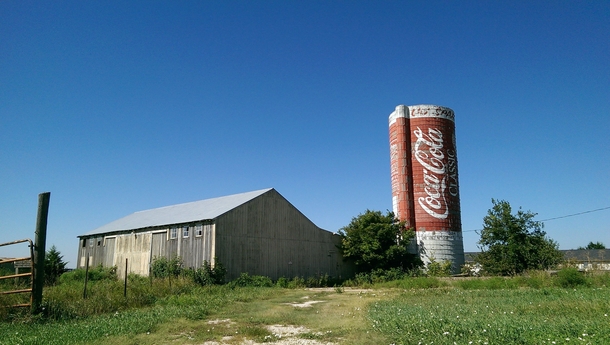 Neglected Coca-Cola silo and shack off the side of a Kansas highway 