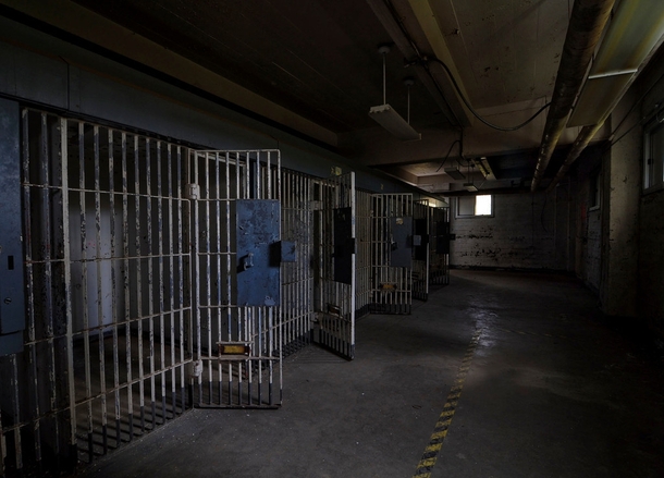 Neglected holding cells in a dreary basement wait for the end of time  OC    x  