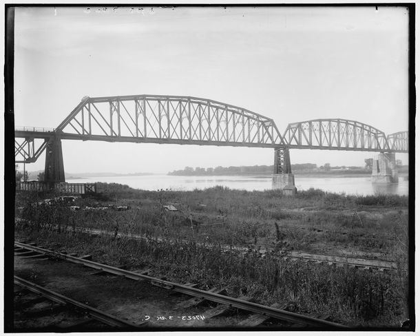 New steel bridge railroad at Glasgow Missouri  is a four-span through truss bridge over the Missouri River belonging to the Kansas City Southern railroad originally built in - and described as the worlds first all-steel bridge 