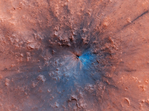 Newly formed impact crater on Mars It looks blue because its a false color image highlighting exposed bedrock which combines several color filters to enhance differences between material compositions Image NASAJPL-CaltechUniversity of Arizona