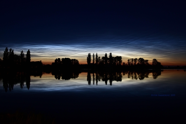 Noctilucent Clouds Reflections and Silhouettes by Peter Simmering