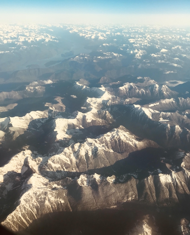 North Shore Mountains from an airplane window Vancouver Canada 