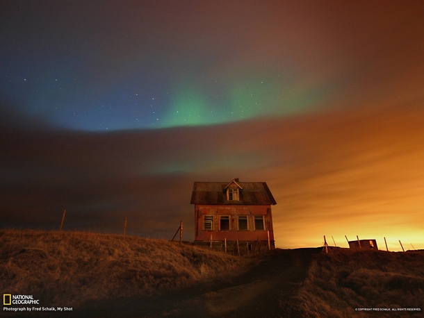 Northern Lights illuminate an abandoned farmhouse Reykjanes peninsula Iceland Photo by Fred Schalk 