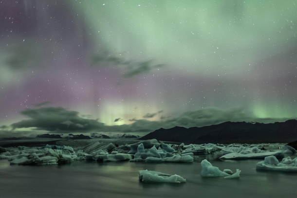 Northern lights over glacial lagoon in Jkulsrln Iceland 