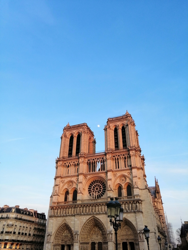 Notre-Dame de Paris France with the moon showing off 