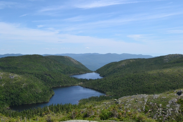 OC I went hiking in a National park in Malbaie and found this two lakes between the mountains QubecCanada 