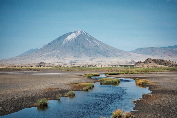 Ol Doinyo Lengai the Mountain of God from the south shore of Lake Natron 