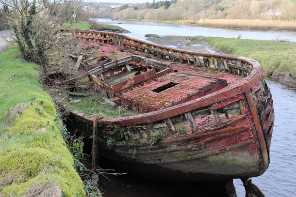 Old boat on tidal river near Innishannon Co Cork Ireland x