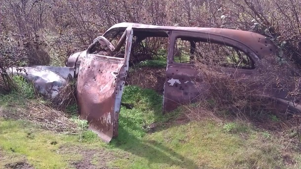 Old Chevy half swallowed by the earth near The Dalles Dam I nicknamed it Artex 