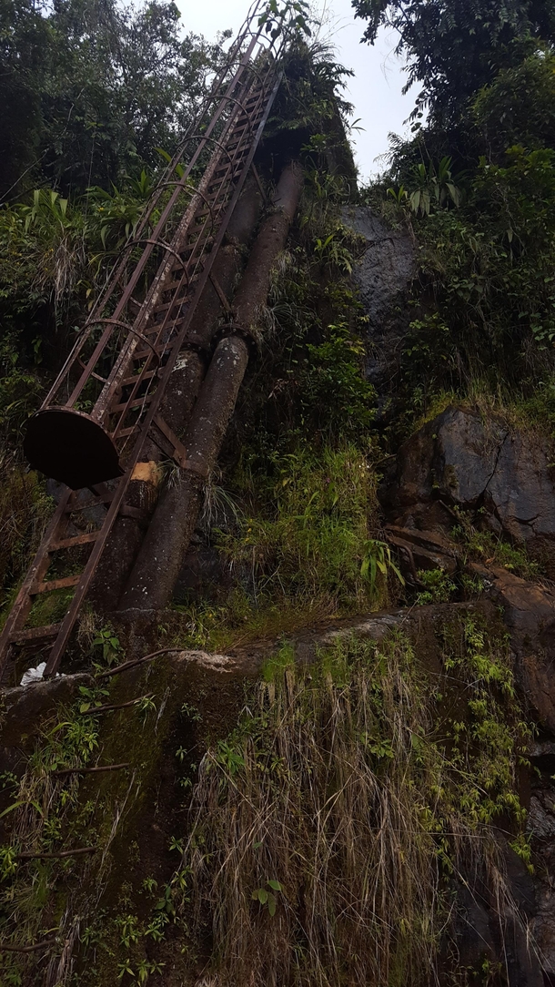 Old ladder leading up to a dam 