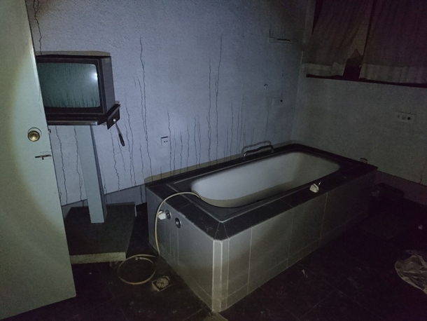 Old lithotripsy tub in abandoned hospital SE Spain The trails on the wall are due to a fire in adjacent rooms 