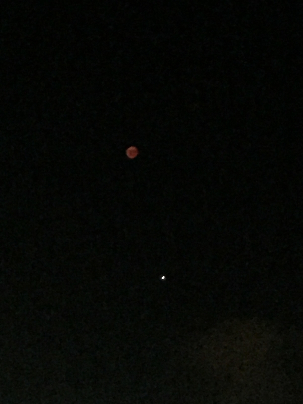 Old pic and sorry for phone quality but its the blood moon and Mars from a roof top in Israel the ISS passed over it before this pic  