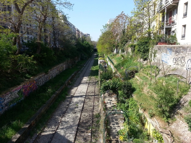 Old Railway inside Paris with gardens along side 