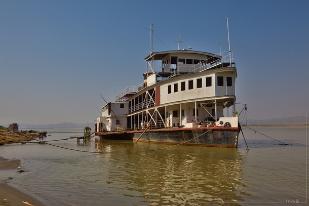 Old side-wheeler on the shore of the Irrawaddy river near Bagan 