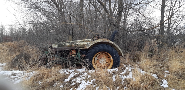 Old tractor abandoned on a farm