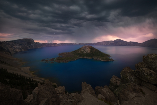 Ominous storm clouds gather as thunder rumbles over Crater Lake National Park OR 