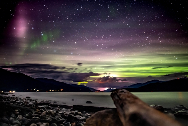 On a random overnight canoe trip the skies rewarded us with these crazy colors while heavy lightning was striking at the end of the lake Thank you Northern Lights  Kootenay Lake British Columbia 