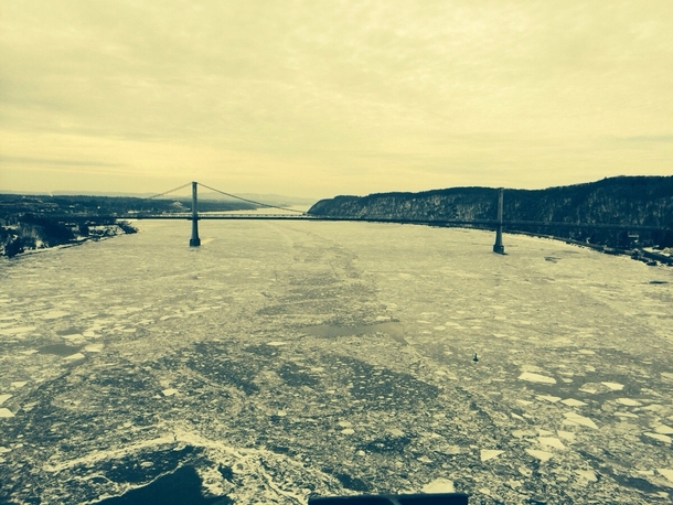 On top of the Walkway over the Hudson in Poughkeepsie NY looking south over a semi frozen hudson river OC 