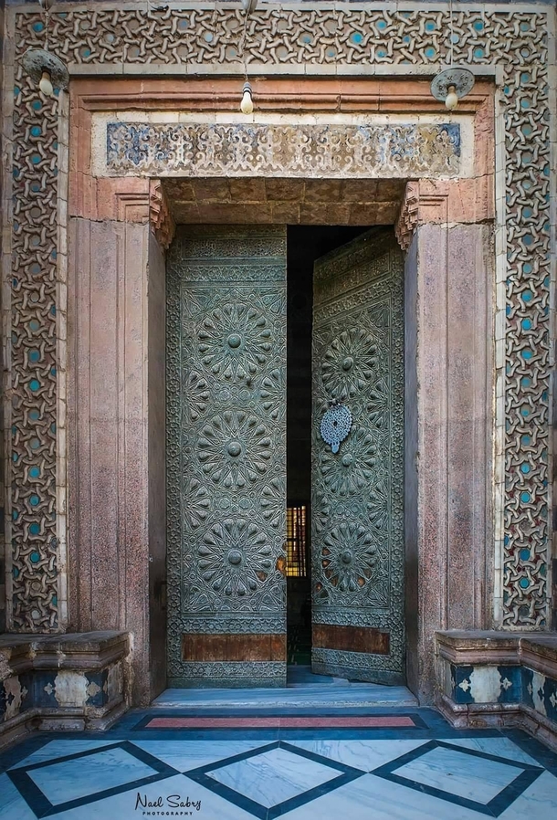 One of the gates of the Mosque of Sultan al Muayyad in old Cairo Egypt located next to Bab Zuwayla built by the Mamluk Sultan al Muayyad Saif al Din Shaykh from which the Mosque takes its name The construction began in  CE and was completed in  CE