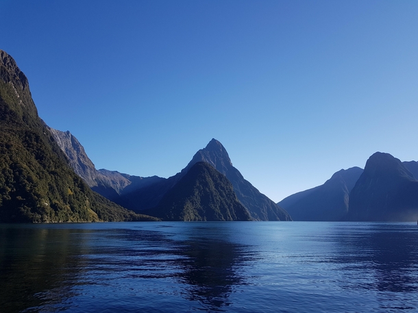 One of the wettest inhabited places on Earth on a cloudless perfect day Milford Sound - New Zealand 