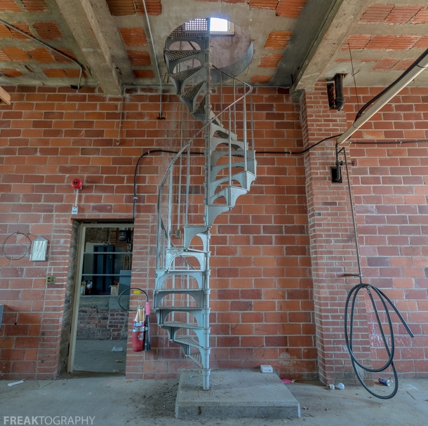 One of three spiral staircases leading up to the attic level of a vacant institution OC   