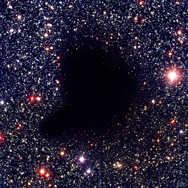 Only  lightyears away and  a lightyear across lies Barnard  a dark molecular cloud that absorbs nearly all visible light from nearby stars Image credit FORS Team -meter VLT Antu ESO