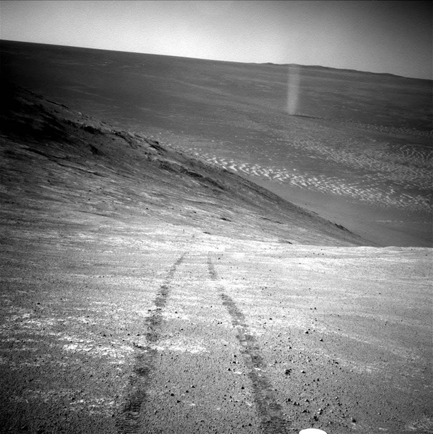 Opportunitys tracks on Mars surface and a martian dust devil 
