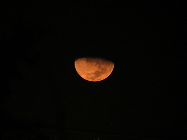 Orange moon set in Lima Peru