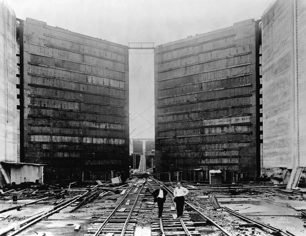 Panama Canal Construction - engineers stand in front of the massive gates of the canal locks  Photo Bettmann 