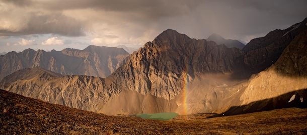Panoramic of Cumulus Mountain with a rainbow sash Alaska 