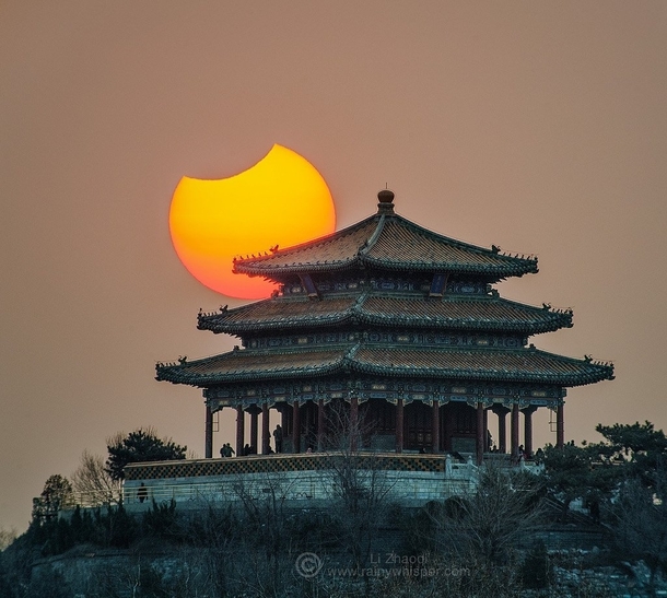 Partial Eclipse over Beijings Forbidden City