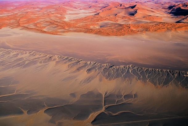 Patterns created by water trails in the Namib Desert after rainfall in the area 