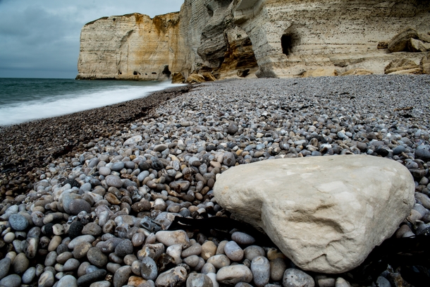 Pebbles on the rocky shoreline Antifer Normandy France 