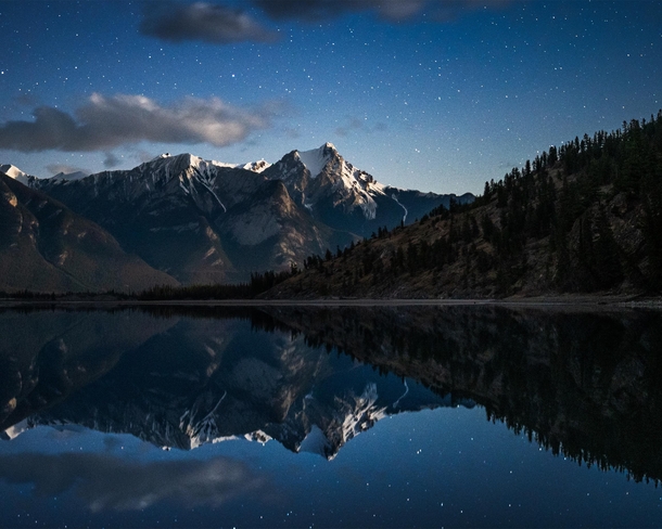 Perfect reflections of the night sky along the Athabasca - Jasper National Park Alberta OC  jackfusco