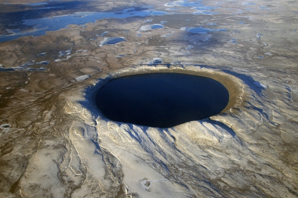 Pingualuit impact crater in northern Quebec Rising m from the surrounding tundra it is km in diameter and  million years old It is one of the deepest lakes in North America m and contains some of the purest fresh water in the world 