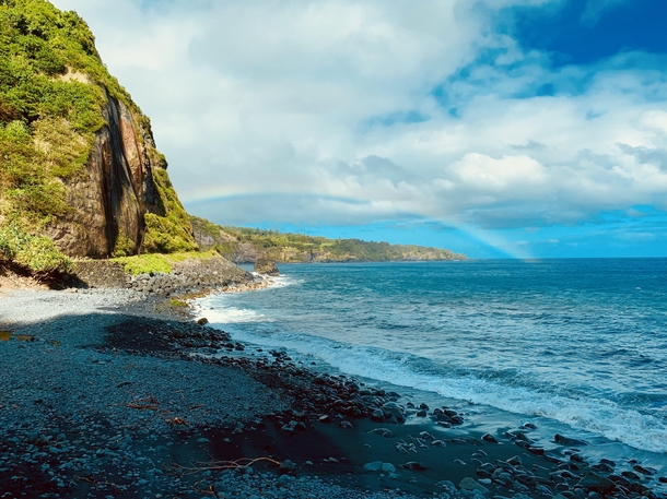 Rainbow off the coast of a Island - Hawaii 
