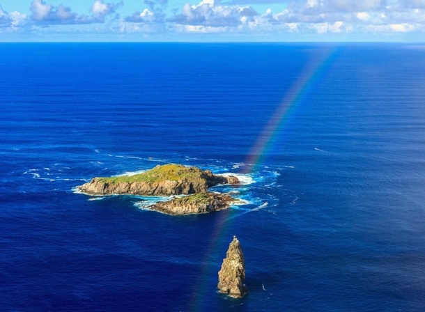 Rainbow over the ocean at Rapa Nui Easter Island 
