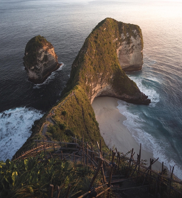 Rays of light cascading down a stretch of coastline in Nusa Penida Indonesia 