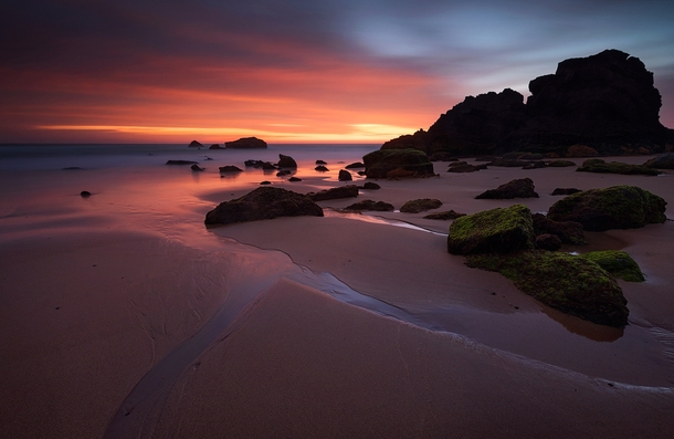 Receding tide I used a long shutter speed to capture movement and glow from fading sunset Portugal 