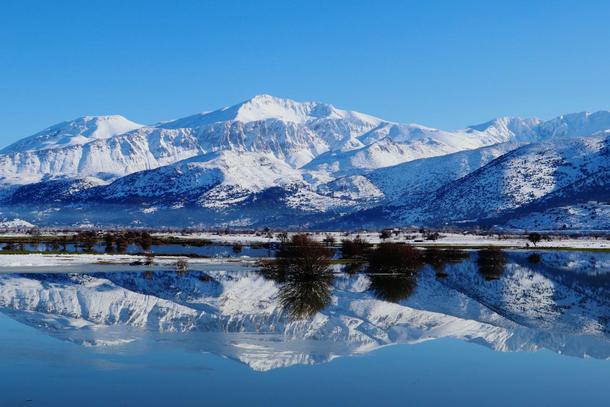 Reflecting mountains at the Lassithi Plateau on Crete Greece 