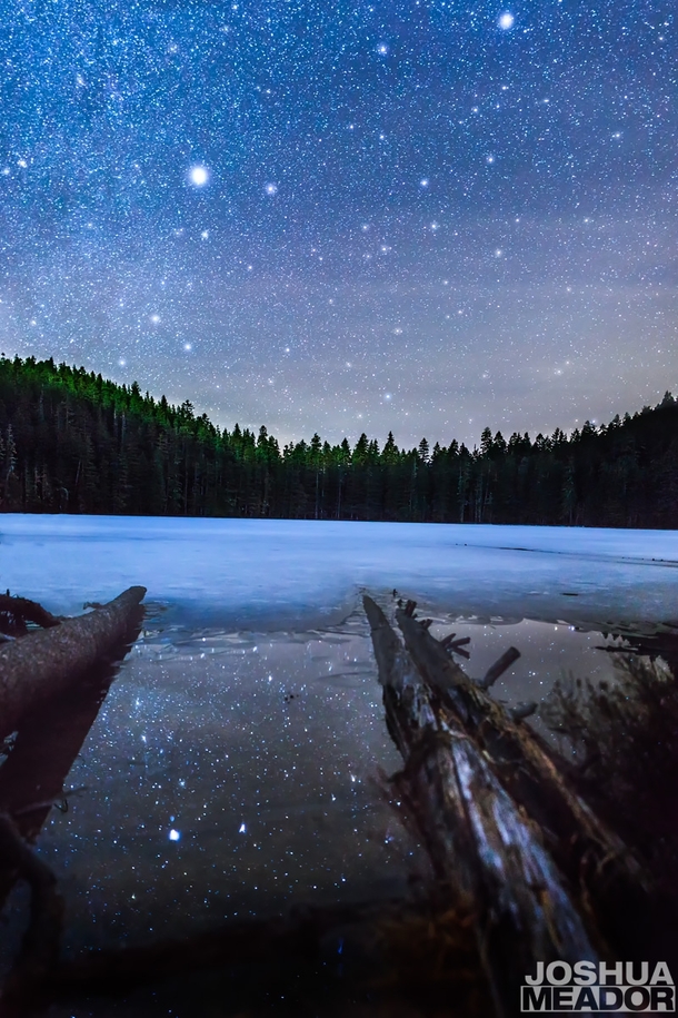 Reflection of the stars in the mostly frozen Upper Twin Lakes Oregon 