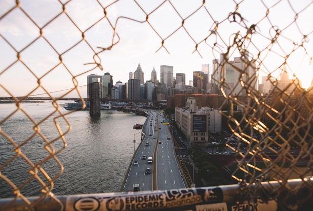 Reshot lower Manhattan through this hole in the fence yesterday caught a cool ray of light too 