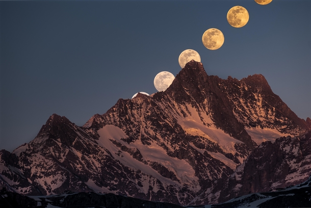 Rise of the super moon behind the Schreckhorn mft - the northernmost four-thousand-metre peak in Europe 