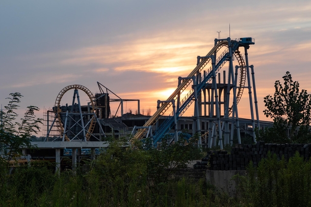 Roller coaster in an abandoned overgrown China theme park 