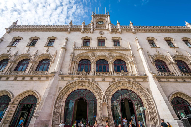 Rossio railway station in Lisbon Portugal opened in  Its most interesting features include the Neo-Manueline faade with the two intertwined horseshoe portals at the entrance