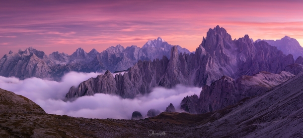 Rugged peaks during a fiery sunset in the Dolomites Italy 