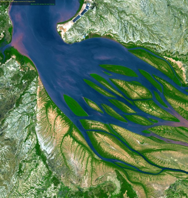 Sapphire waters tinged with pink sediment seem to get tangled amid emerald vegetation in a satellite picture of Bombetoka Bay on the northwestern coast of Madagascar  OS